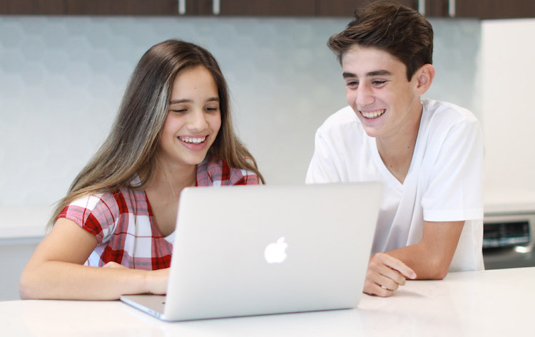 boy and girl coding from home